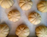 A picture of step 13 of Pumpkin shaped dinner rolls.
