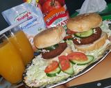 A picture of step 7 of Reshmi kabab burger with orange juice.
