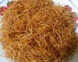 A picture of step 2 of Kunafa and Qashtalia Decorated with Oranges, Strawberries, and Bananas.