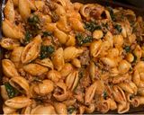 A picture of step 4 of Easy stuffed shells (pasta bake) spinach mushrooms and ricotta cheese.