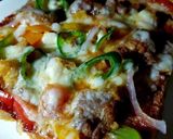 A picture of step 6 of Chicken tikka bread pizza 😋👍.