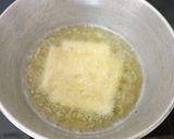 A picture of step 2 of Crispy Panner with hot sauce.