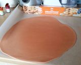 A picture of step 9 of Vickys Halloween Pumpkin Piñata Cake, Decorating Idea.