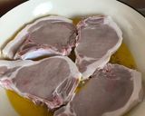 A picture of step 3 of Brined Pork Chops with Hasselback Potatoes, tender, buttery Asparagus and sharp Hollandaise Sauce.