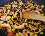 A picture of step 5 of Spicy chicken, veg and black rice one pan.