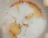 A picture of step 2 of Fried yolk egg.