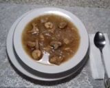 A picture of step 1 of Chicken soup with Rice vermicelli, shrimp, and mushrooms.