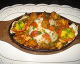 A picture of step 4 of Rice sizzler with tomato coulis.