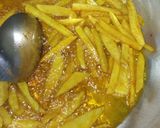 A picture of step 2 of Chips masala, wetfry beef with sausages.