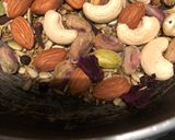 A picture of step 2 of Thandai with rose petals.