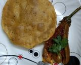 A picture of step 4 of Kashmiri Khatte Baigan with Khasta Puri.