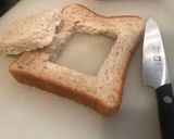 A picture of step 1 of Egg-in-a-Hole Bacon Toast.