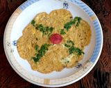 A picture of step 7 of Veg omelette 🥚🥚🥬🍅.