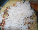 A picture of step 10 of Peanut rice with bundi raita.