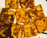 A picture of step 2 of Tofu fry in single garlic with curry leaves powder.