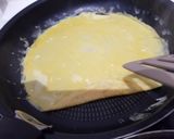 Une image de l'étape 8 de Tamagoyaki (omelette japonaise sucrée).