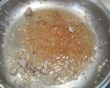 Foto del paso 2 de la receta: Arroz meloso de pollo al ajillo