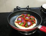 A picture of step 10 of Pan Pizza with paneer stuffing without yeast.
