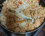 A picture of step 2 of Singapore chicken noodles rice.
