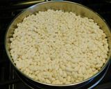 A picture of step 1 of Upma with puffed rice and colorful veggies.