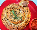 A picture of step 13 of Boerewors sausage roll.