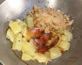 A picture of step 2 of Achari aam sabji.