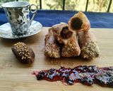 A picture of step 10 of Znoud-el-sit with creamy choco hummus filling and red grape sauce.