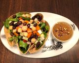 A picture of step 4 of Tortilla Greens Chickpeas Salad Bowl with Refried Bean Dates dressing.