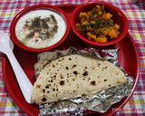 A picture of step 4 of Masala aalu,cucumber carrot raita with plain roti (simple Lunch).