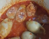 Foto del paso 5 de la receta: Tubos de calamar rellenos en salsa de tomate con arroz blanco