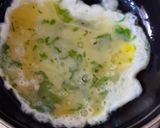 A picture of step 2 of Tortilla Wrap with egg and veggies.