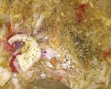 A picture of step 3 of Fish peepered soup garnish with parsely.