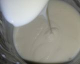 A picture of step 9 of Vanilla cream filled doughnuts.