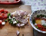 A picture of step 2 of Egg tomato onion omlette.