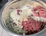 Une image de l'étape 7 de Courgettes et poivrons farcis bœuf, tomates et oignon.