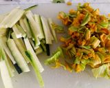 A picture of step 1 of Spaghetti with speck, courgette and pumpkin flowers.