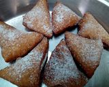 A picture of step 4 of Mandazi with cardamom powder.