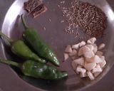 A picture of step 6 of Urad/maash ki khatti daal with bajrey ki roti.