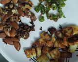A picture of step 3 of Healthy Makhaana Salad with fruits veggies and nuts.