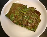 A picture of step 14 of Paneer wrapped in banana leaf.