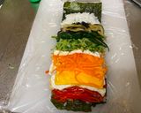 A picture of step 5 of Rainbow Roll Sushi.