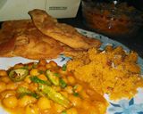 A picture of step 3 of Cholay batory with halwa puri.