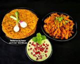 A picture of step 6 of Multigrain Masala Paratha - Ivy Gourd Sabzi - Mint Pomegranate Dahi Raita.