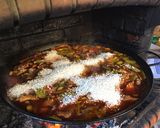 A picture of step 12 of Paella with Vegetables and Meat.