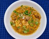 A picture of step 4 of Lonka Roshun Pora Masala Chicken.