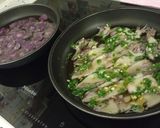 Foto del paso 6 de la receta: Chipirones al ajillo y patatas violetas fritas