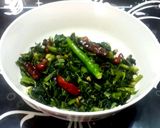 A picture of step 2 of Kolmi shaag bhaaja (Water Spinach stir fried).