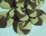 A picture of step 8 of Two tone cookies with chocolate filled inside.