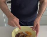 A picture of step 3 of Baked Peaches with Amaretti, Dark Chocolate, Ice Cream and Mint.