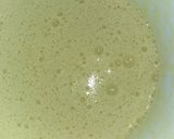 A picture of step 2 of Maize Malva Pudding drizzled with custard.